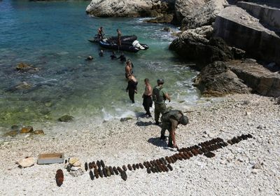 In Albania, divers fish for WWII bombs