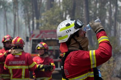 Villages battle wildfires in Portugal; Europe swelters