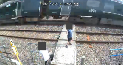 Warning to parents after kids dance on rail tracks as train roars past in alarming footage