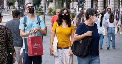 Commuters and shoppers wear masks in flashback to height of Covid pandemic as cases soar