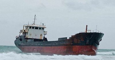 Eerie 'ghost ship' runs aground on beach during storm with discarded lifejackets nearby