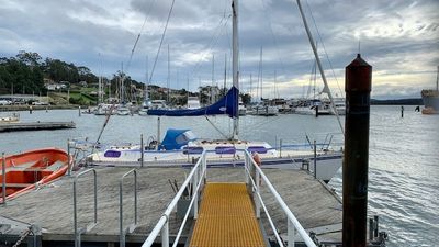 Tasmanian man's attempt to secure his yacht in storm 'unwise', coroner rules