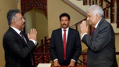 Sri Lanka’s PM sworn in as interim president after Rajapaksa resigns