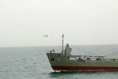 Iran unveils naval drone division as Biden tours Mideast