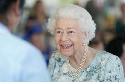 ‘Typical!’ Queen see funny side as mobile phone rings during hospice visit