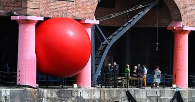 Huge giant red ball arrives in Liverpool and you can see it as it moves around the city