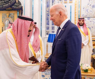 Biden meets Saudi king with a handshake, state news agency photo shows