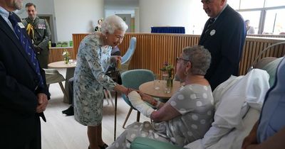 Queen's hilarious quip as man's phone rings at crucial moment during surprise visit