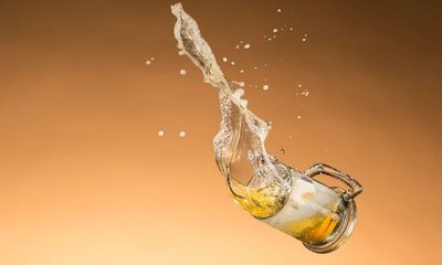 Avoid booze and close the curtains: how to cope in England’s 40C heatwave