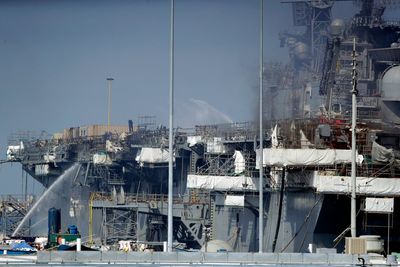Navy disciplines officers in massive ship fire