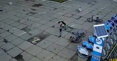 Terrifying moment Ukrainians dive for cover during Russia missile strike that kills 23