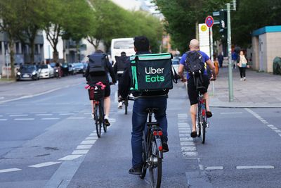 Uber Eats couriers report lower wages