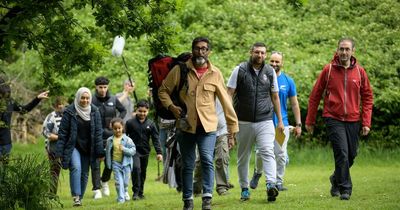 Sanjeev Kohli surprises Pride of Scotland winners Boots & Beards during a hike in the park
