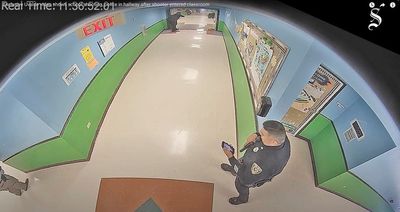 Uvalde officer seen checking phone in surveillance footage is husband of teacher killed in massacre