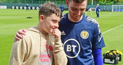 Scotland and Liverpool star Andy Robertson surprises Child of Courage Keiran Reid with his Pride of Scotland award