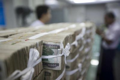 Myanmar central bank orders firms with up to 35% foreign ownership to convert forex