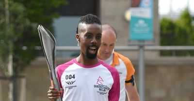 Groundbreaking reality star becomes first to run Queen's Baton Relay in high heels