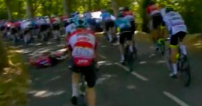 Tour de France rider Owain Doull hits the deck after running over stray bottle