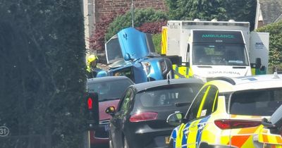 Police shut down Ayr street after car flips onto its side