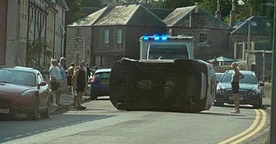 Car flips onto side in Fife as emergency services race to scene