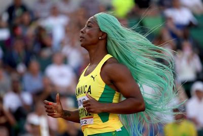 Shelly-Ann Fraser-Pryce fixes wig mid-race but still qualifies in worlds 200m