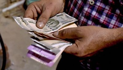 Business: Rupee hits all-time low of 80 against US dollar, subdues Indian stock indices