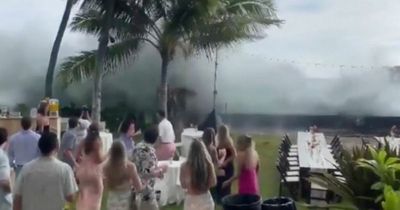 Enormous wave crashes Hawaii wedding sending chairs and tables flying as guests scream