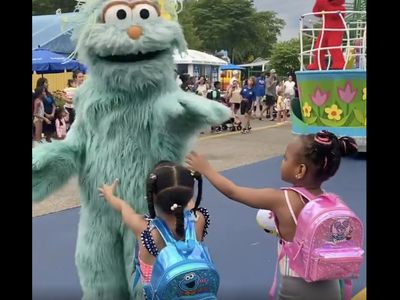 Sesame Place apologizes after video shows 2 Black girls being passed over at a parade
