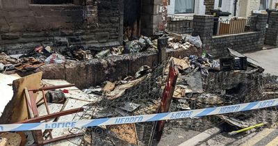 Images show the devastating aftermath of a suspected arson attack on a Cardiff building