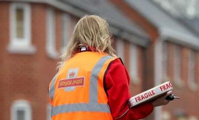 Royal Mail workers vote to go on strike in dispute over pay