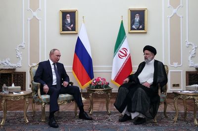 Small table diplomacy: Vladimir Putin arrives in Tehran for meetings with leaders of Iran and Turkey