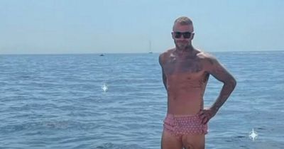 David Beckham poses in tiny trunks on hols as wife Victoria tells fans 'You're welcome'