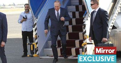 'Clumsy' Vladimir Putin hobbles down steps with arm stiff by side as he arrives in Iran