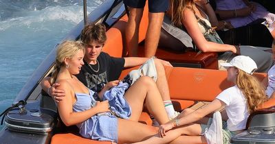Cruz Beckham, 17, cuddles up to girlfriend during family boat trip in Italy