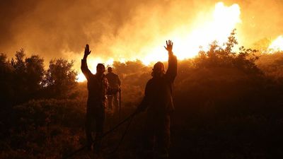 Hundreds flee wildfires in Greece and Italy as Europe's heat wave set to linger into next week