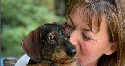 Scottish TV host Lorraine Kelly has fun in the sun with daughter's puppy Ruby