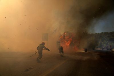 AP PHOTOS: Wildfires surge across Europe in dry, hot weather