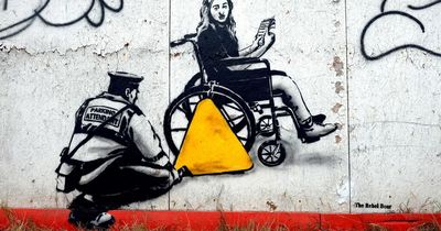 World-famous graffiti artist paints mural in support of wheelchair user taken to court for parking in disabled bay