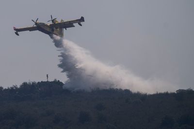 European wildfire threat recedes as temperatures drop