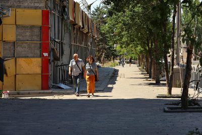 Residents of captured Ukrainian port city try to survive among its ruins