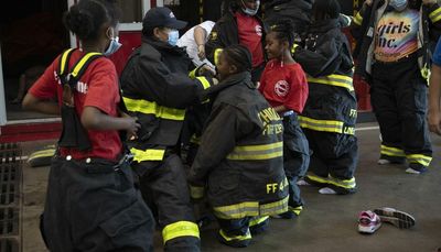 Girls gear up to be firefighters for a day — and take steps toward a possible career path