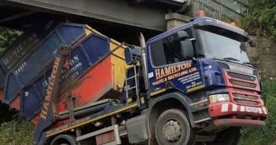 Edinburgh bypass drivers face delays as skip lorry gets stuck under bridge