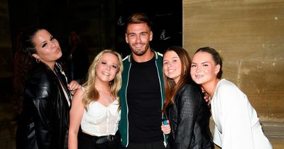 ITV Love Island's Jacques O'Neill looks happy as he poses with fans in Manchester after quitting show