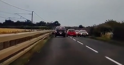 Idiot driver overtakes taxi on blind corner in terrifying near-miss on Scots road