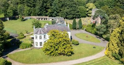 The country estate in need of modernisation that has a cottage with a tower and a garden lake