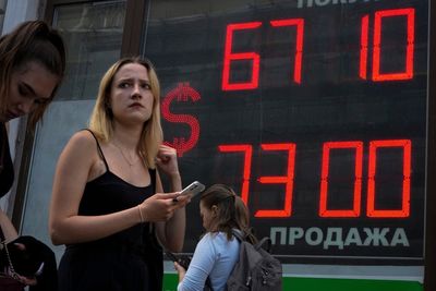 Russia's central bank slashes rate, saying inflation slows