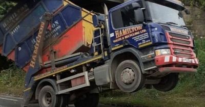 Traffic halted in Edinburgh after skip lorry gets stuck under a bridge