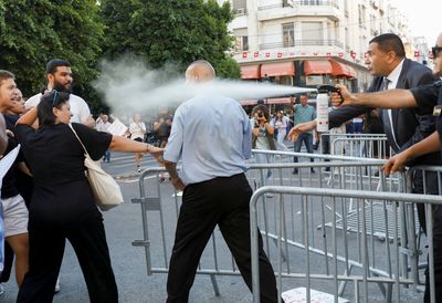 Tunisian police disperse protesters with pepper spray and sticks
