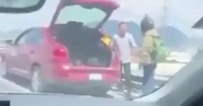 Horrifying moment Uber Eats driver is THROWN off bridge in sickening road rage attack