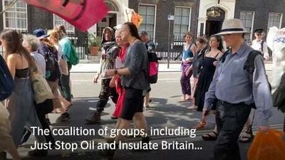 Hundreds Of Climate Change Protestors Descend On Parliament Square